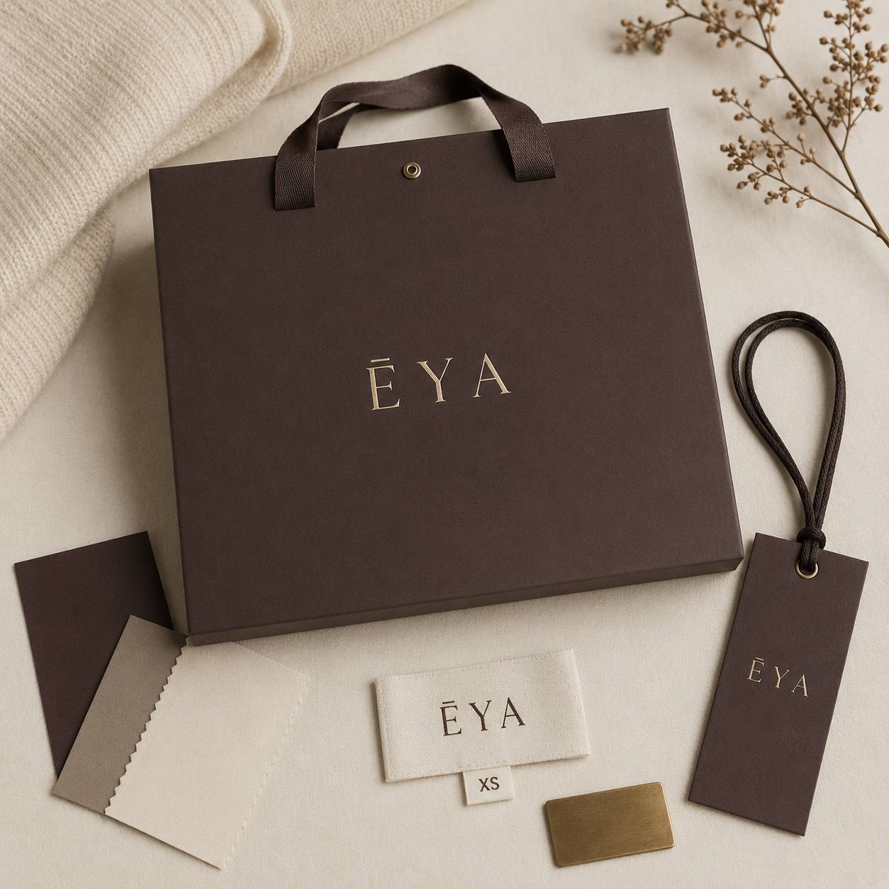 ĒYA packaging: gift box, hang tag and woven label